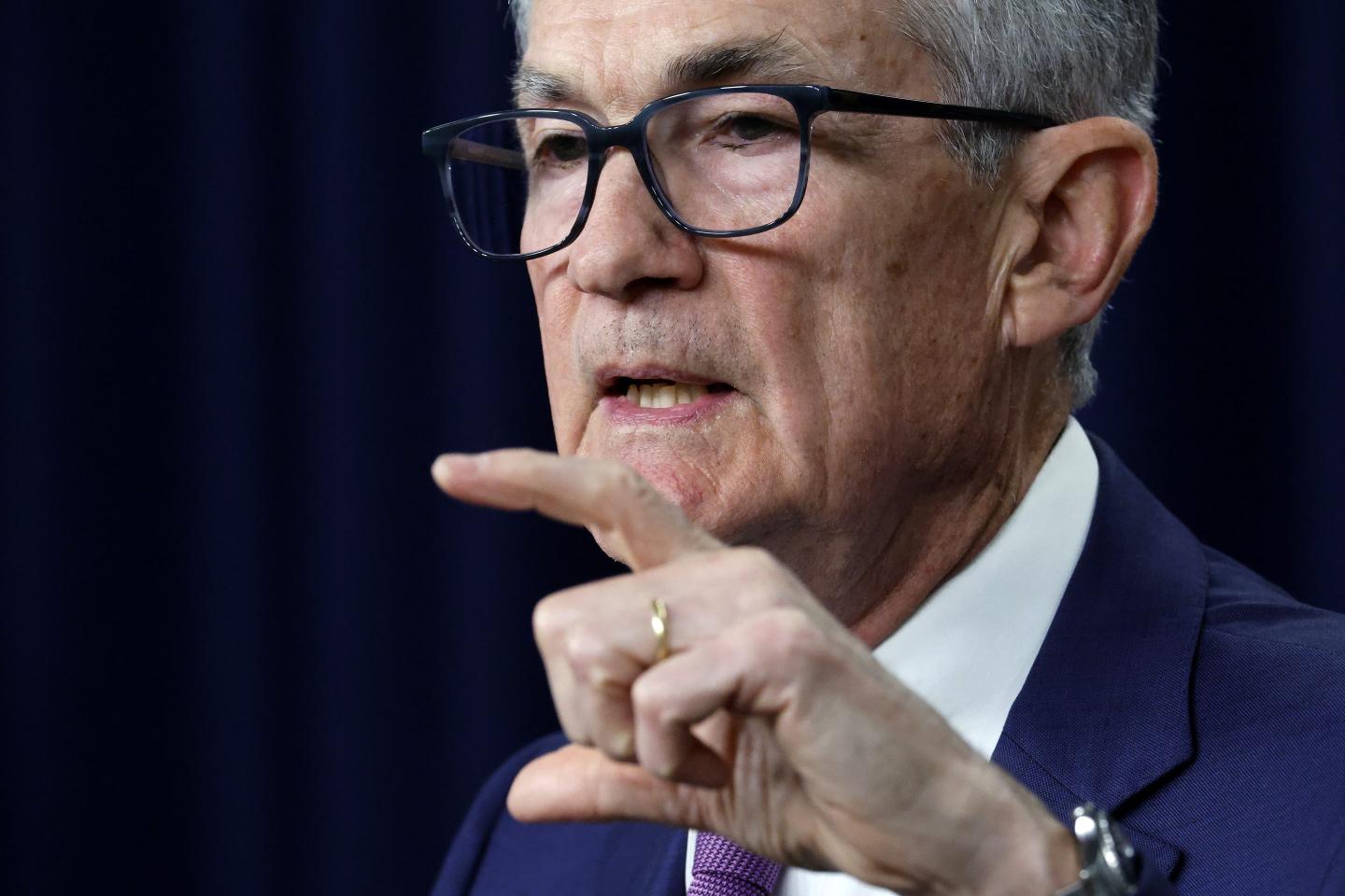 Fed Chair Jerome Powell gestures with hand