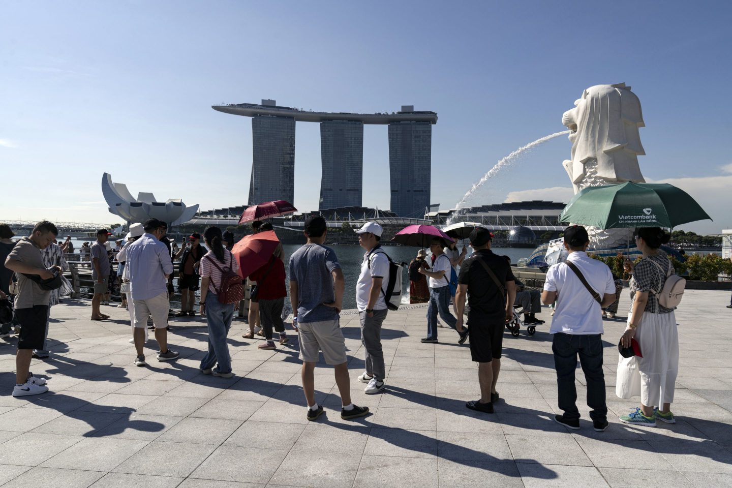 A view of the Marina Bay Sands hotel and casino and the Merlion statue in Singapore.