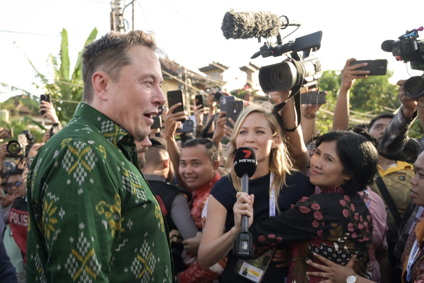 Tech billionaire Elon Musk (L) arrives to inaugurate satellite unit Starlink at a community health center in Denpasar on Indonesia's resort island of Bali on May 19, 2024.