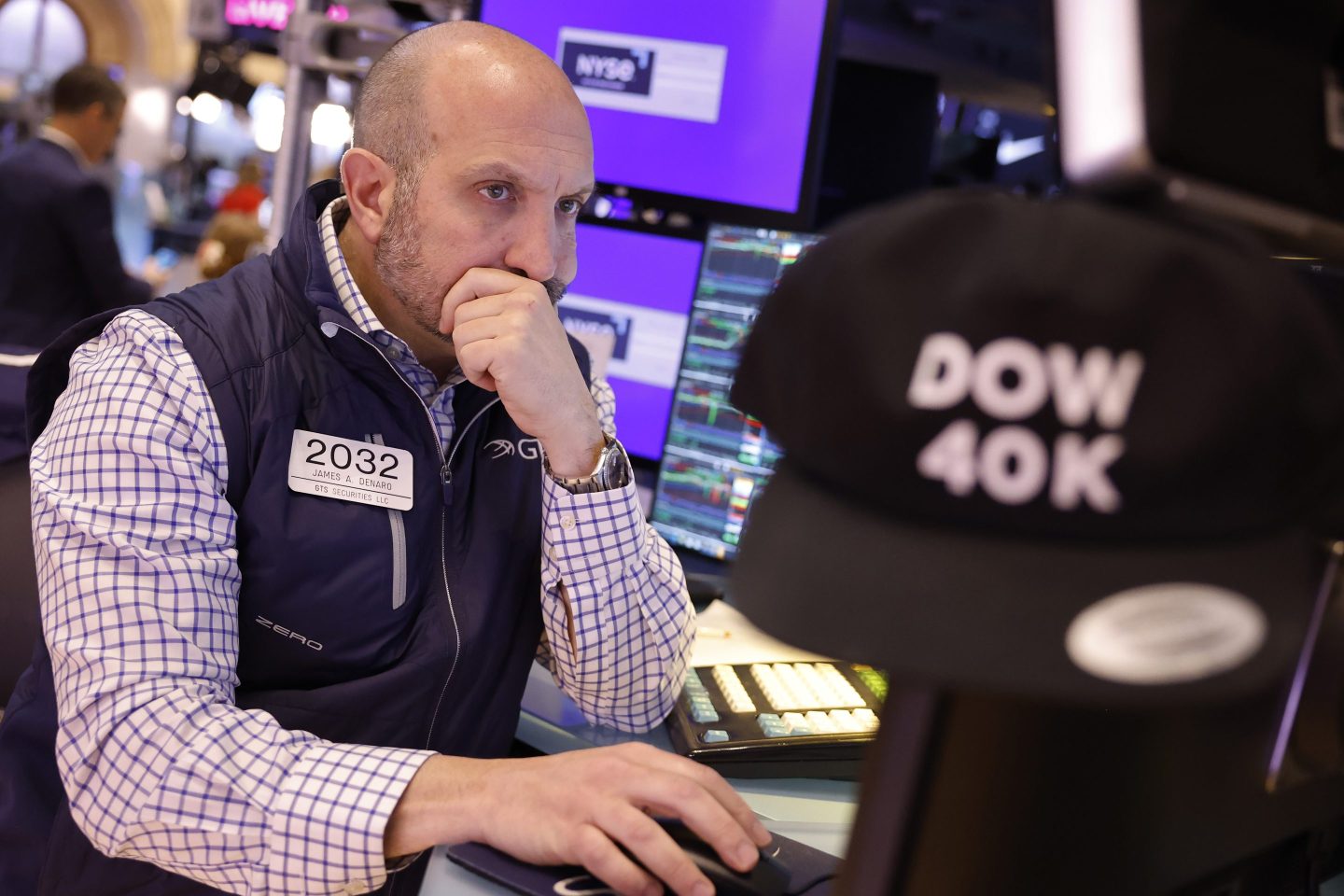 Traders work on the floor of the New York Stock Exchange during morning trading on May 17, 2024.