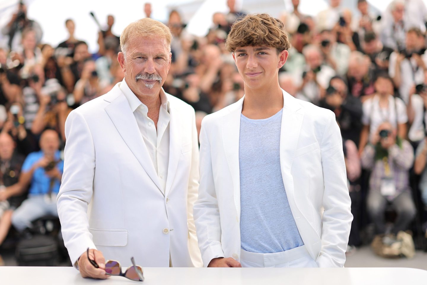 Kevin Costner and Hayes Costner attend the "Horizon: An American Saga" Photocall at the 77th annual Cannes Film Festival at Palais des Festivals on May 19, 2024 in Cannes.