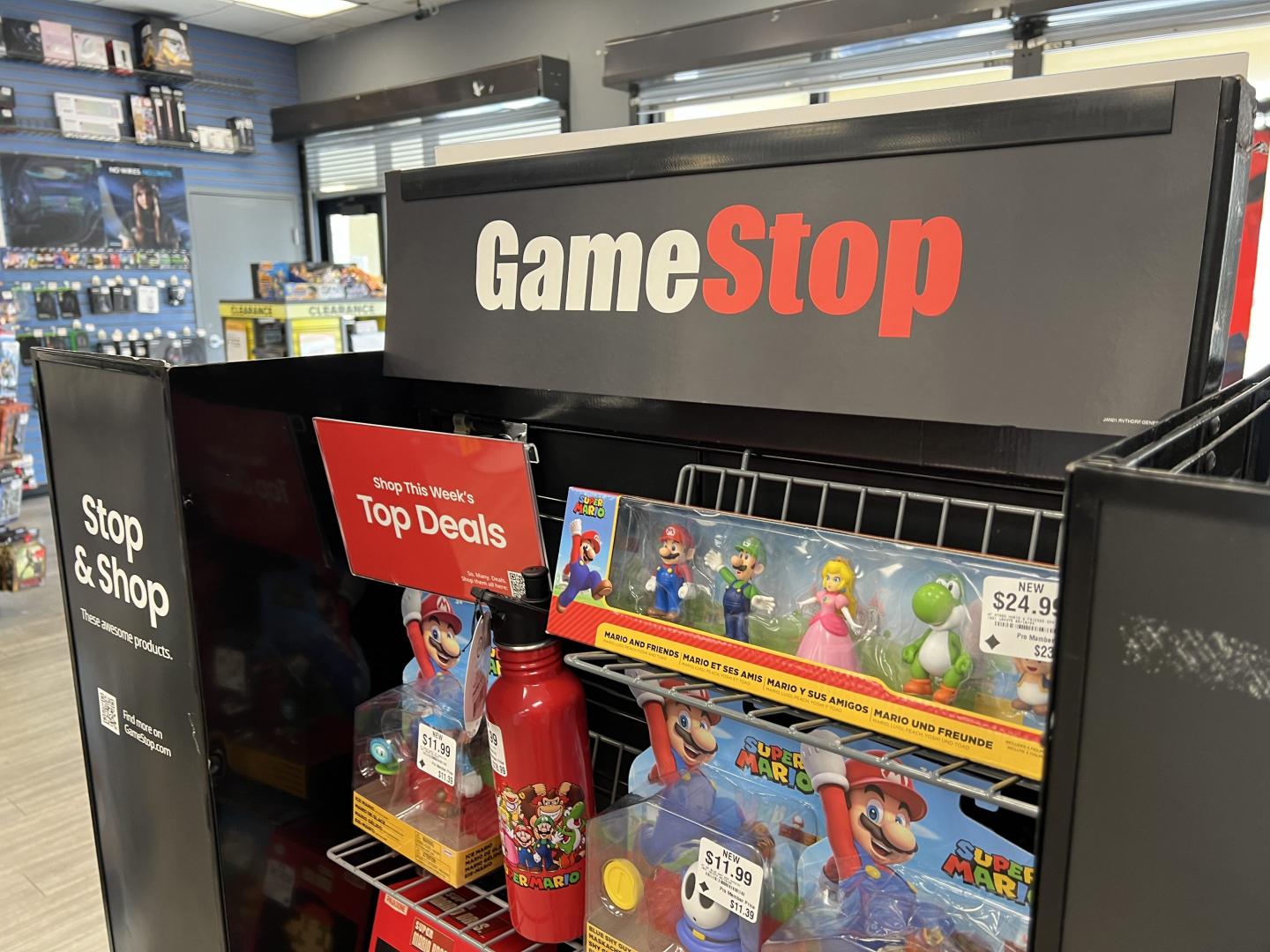 Merchandise lines the shelves of a GameStop store