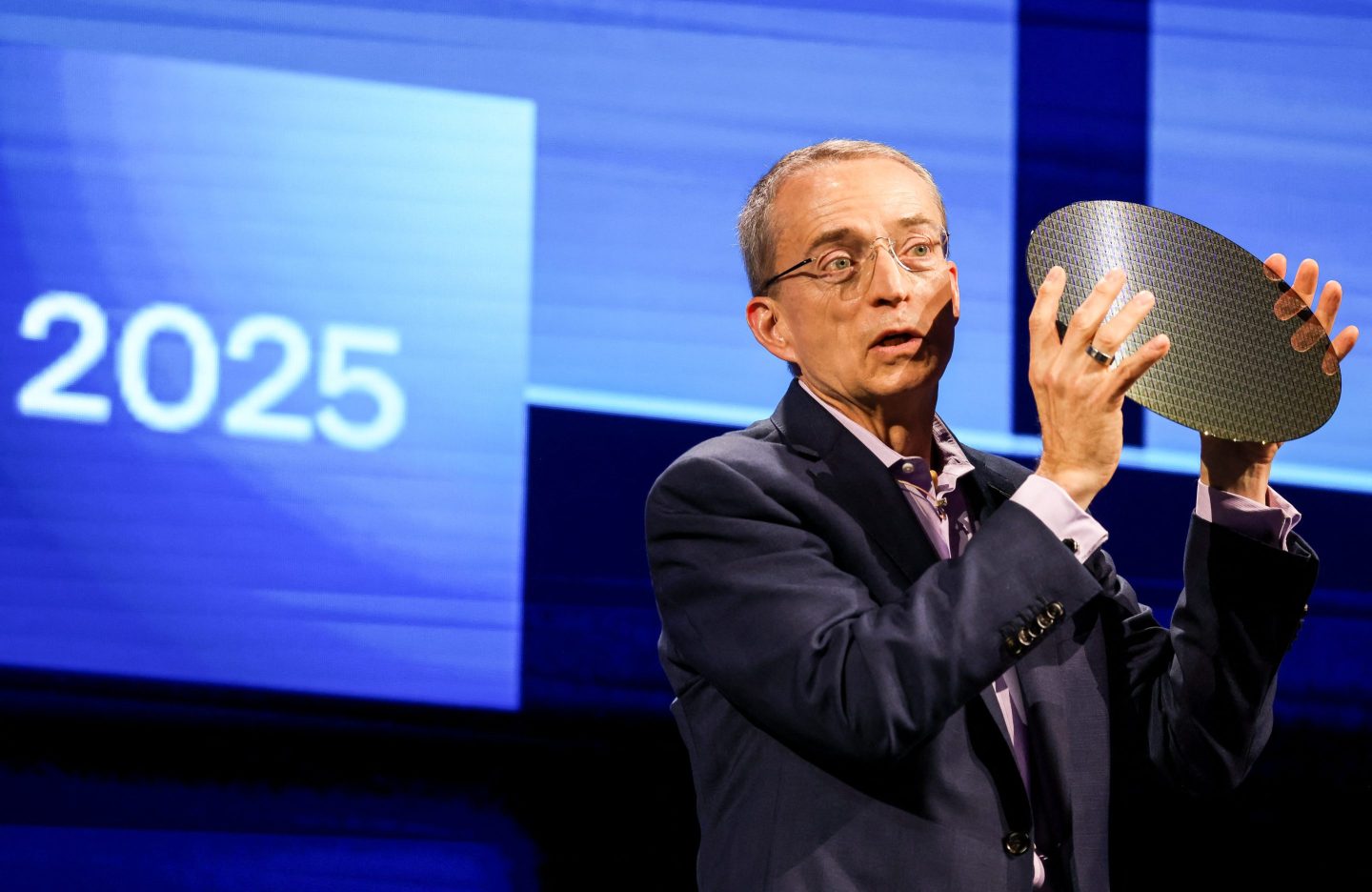 Intel CEO Pat Gelsinger holds a sample of a wafer during his keynote speech at Computex 2024 in Taipei on June 4.