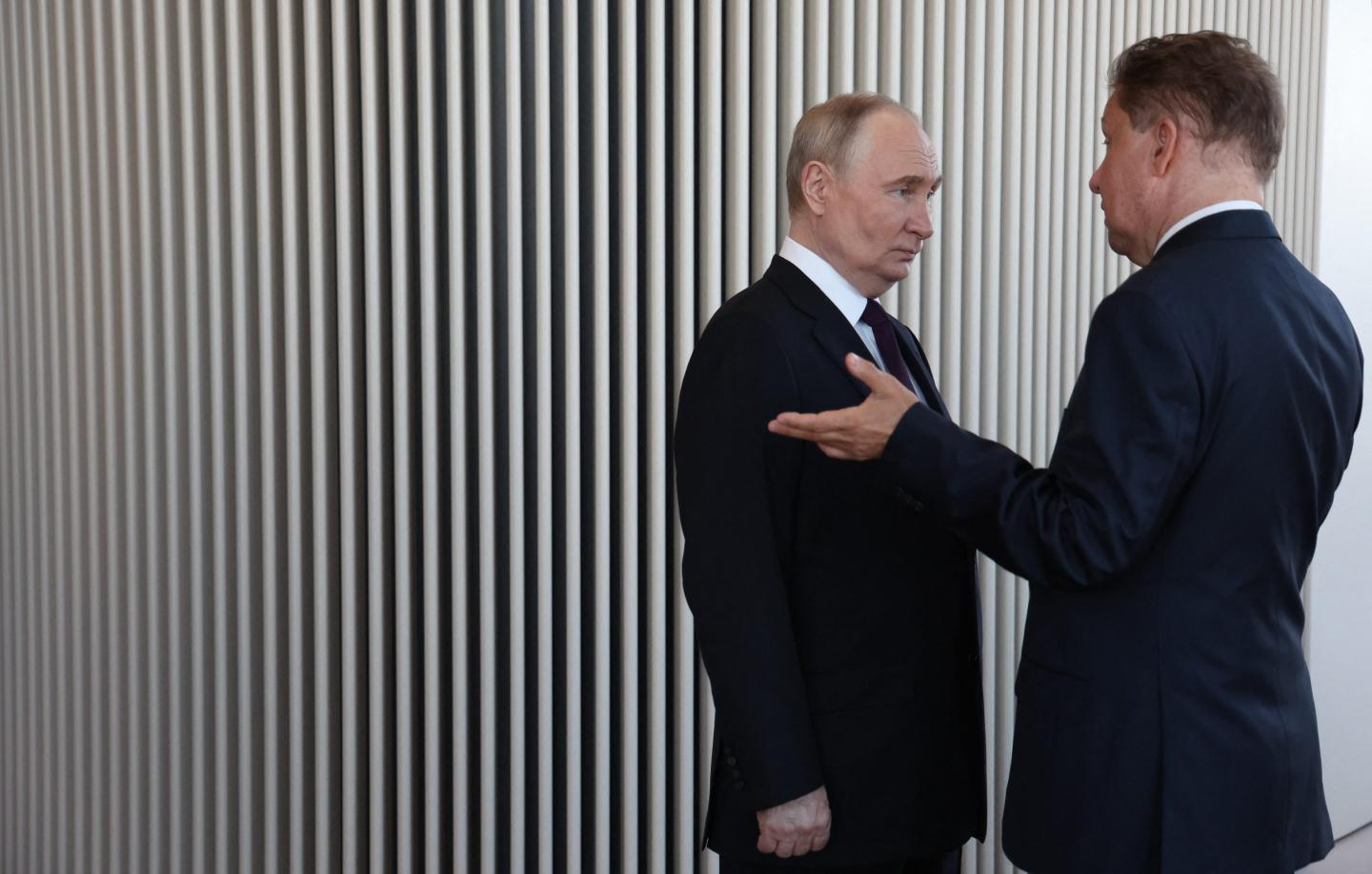 In this pool photograph distributed by Russian state agency Sputnik, Russia's President Vladimir Putin (L) speaks with Russia's energy giant Gazprom CEO Alexei Miller as they visit the Lakhta Centre skyscraper, the headquarters of Russian gas monopoly Gazprom in Saint Petersburg.