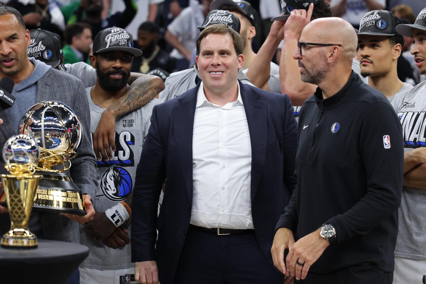 Patrick Dumont smiles at NBA game