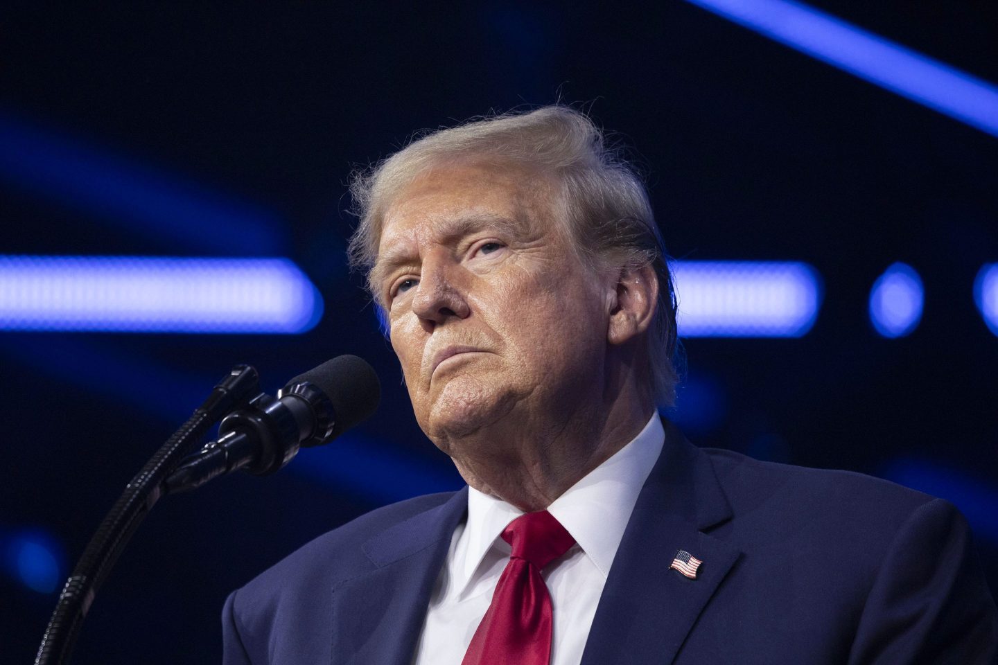 Former President Donald Trump somberly looks out at the crowd during his keynote address at Turning Point Action's "The People's Convention" on June 15, 2024 in Detroit, Michigan.
