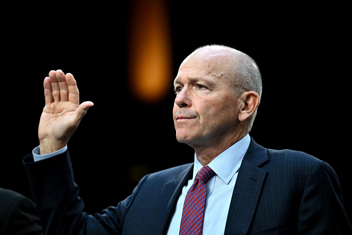 Boeing CEO Dave Calhoun raises hand