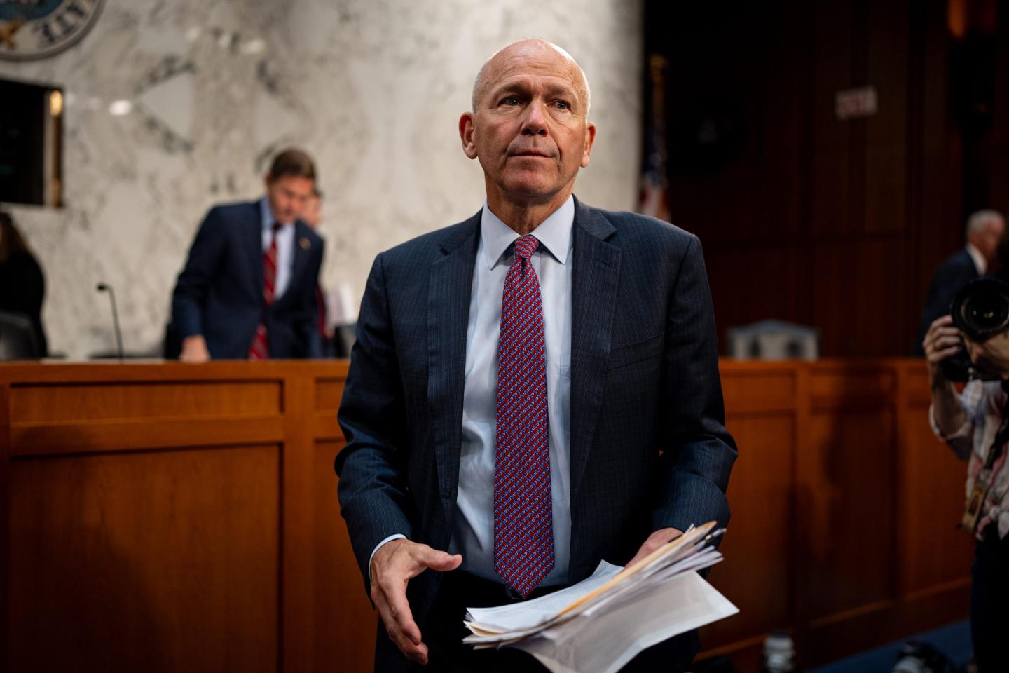 Boeing CEO Dave Calhoun seen holding papers at Tuesdays Senate hearing.