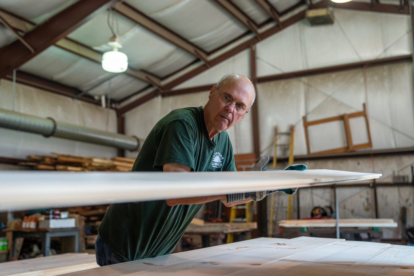 Photo of a man working in a sawmill