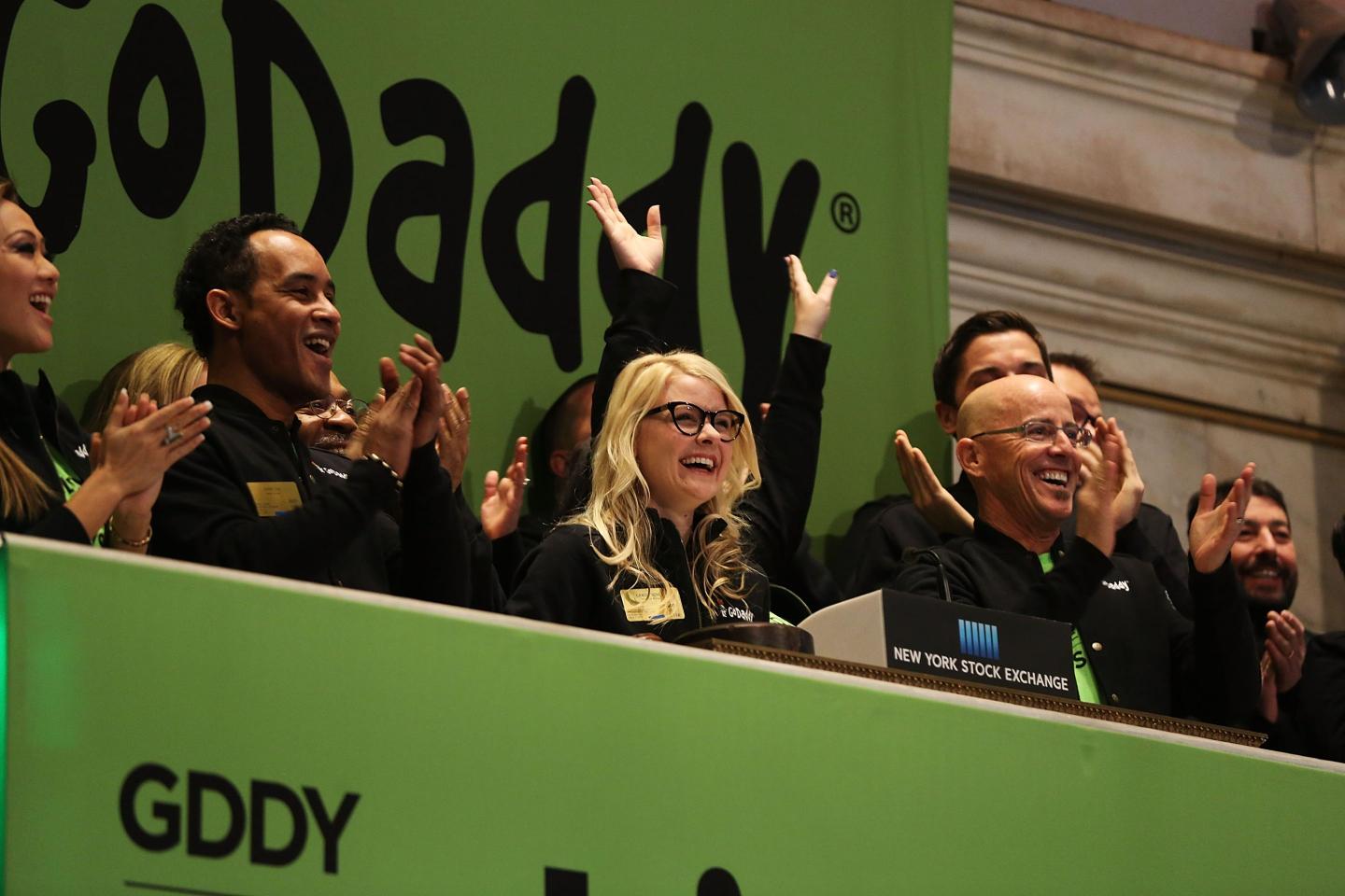 people cheering at the New York Stock Exchange