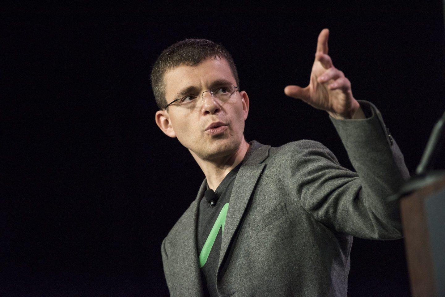 Affirm founder Max Levchin looks into the distance and points with his hand.