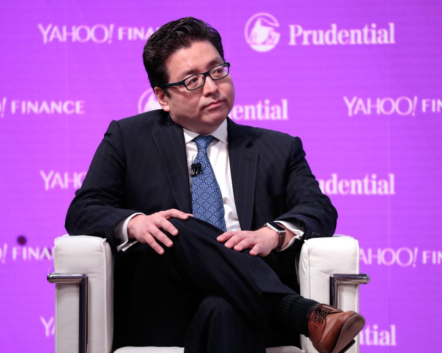 Tom Lee sits on chair