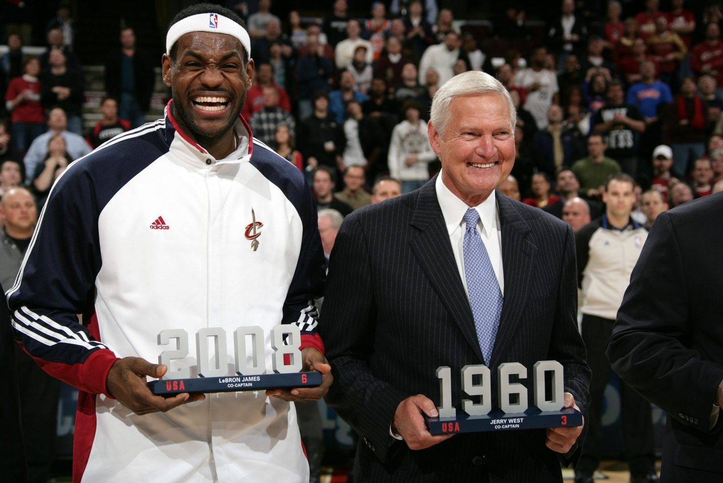 NBA legends Lebron James and Jerry West stand side by side, smiling