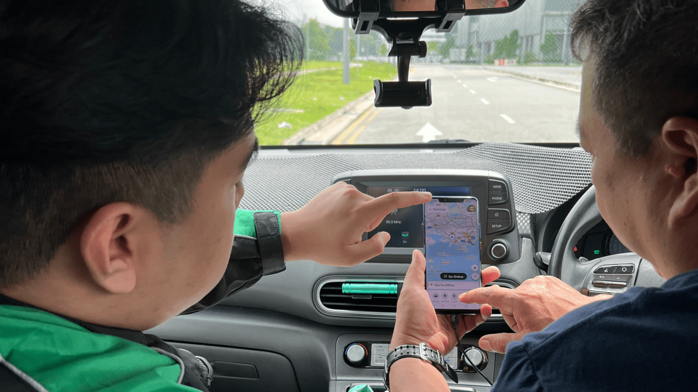 A ride-hailing driver uses the Grab app in Singapore.