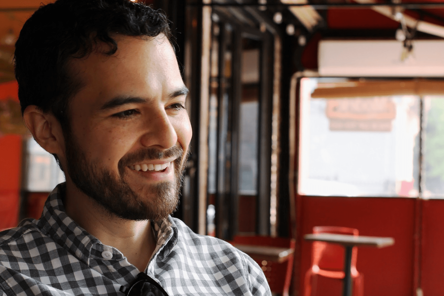 Omar Caneles sitting in the patio of Seis Vecinos