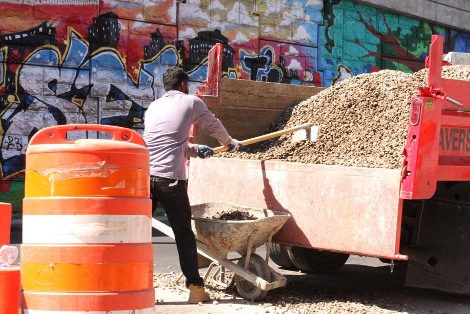 A man paving streets in the South Bronx.