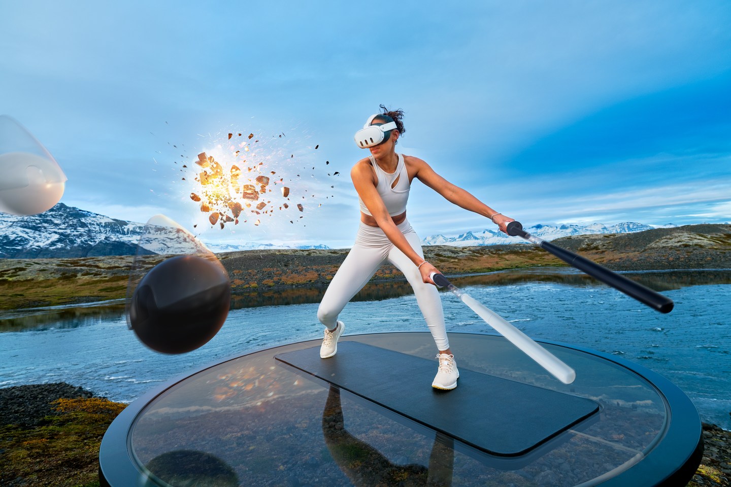 A woman in white workout gear and a VR headset holds sabers while standing in a virtual reality backdrop