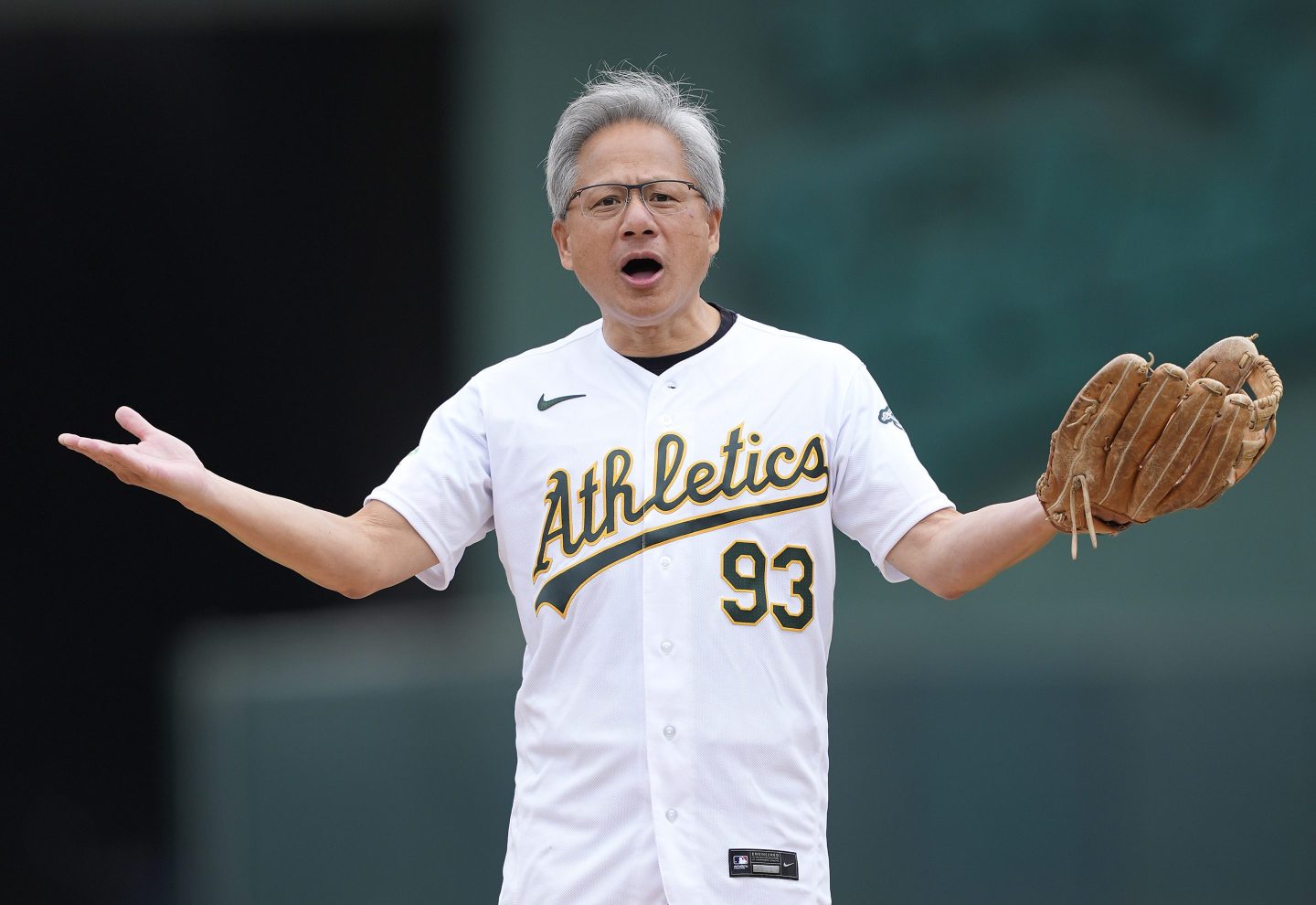Jensen Huang CEO of NVIDIA stands on the mound waiting to throw out the ceremonial first pitch prior to the start of the game between the Houston Astros and Oakland Athletics on May 25, 2024 at the Oakland Coliseum in Oakland, California.