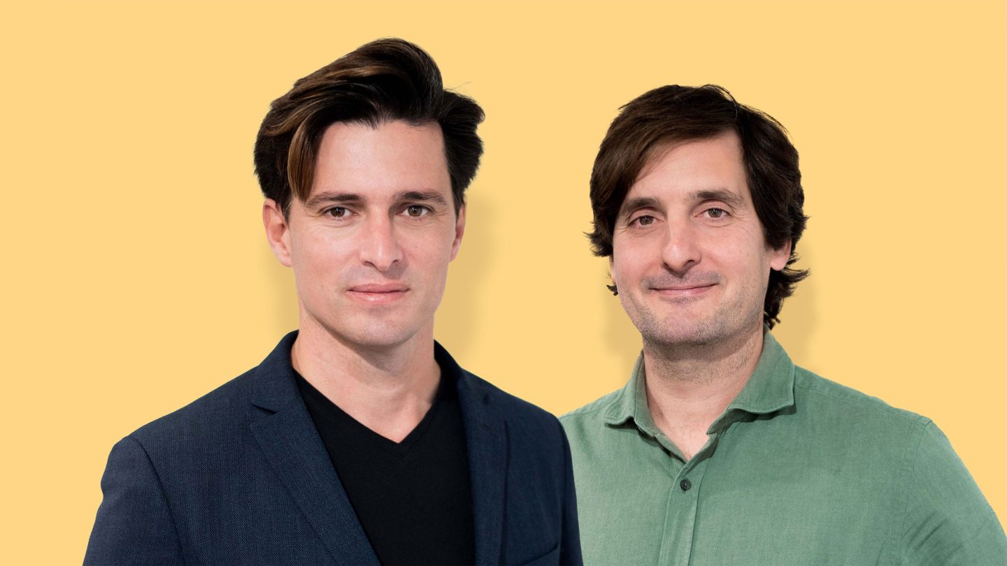 Unbabel cofounders Vasco Pedro, CEO, and João Graça, chief technology officer, pictured against a yellow backdrop.