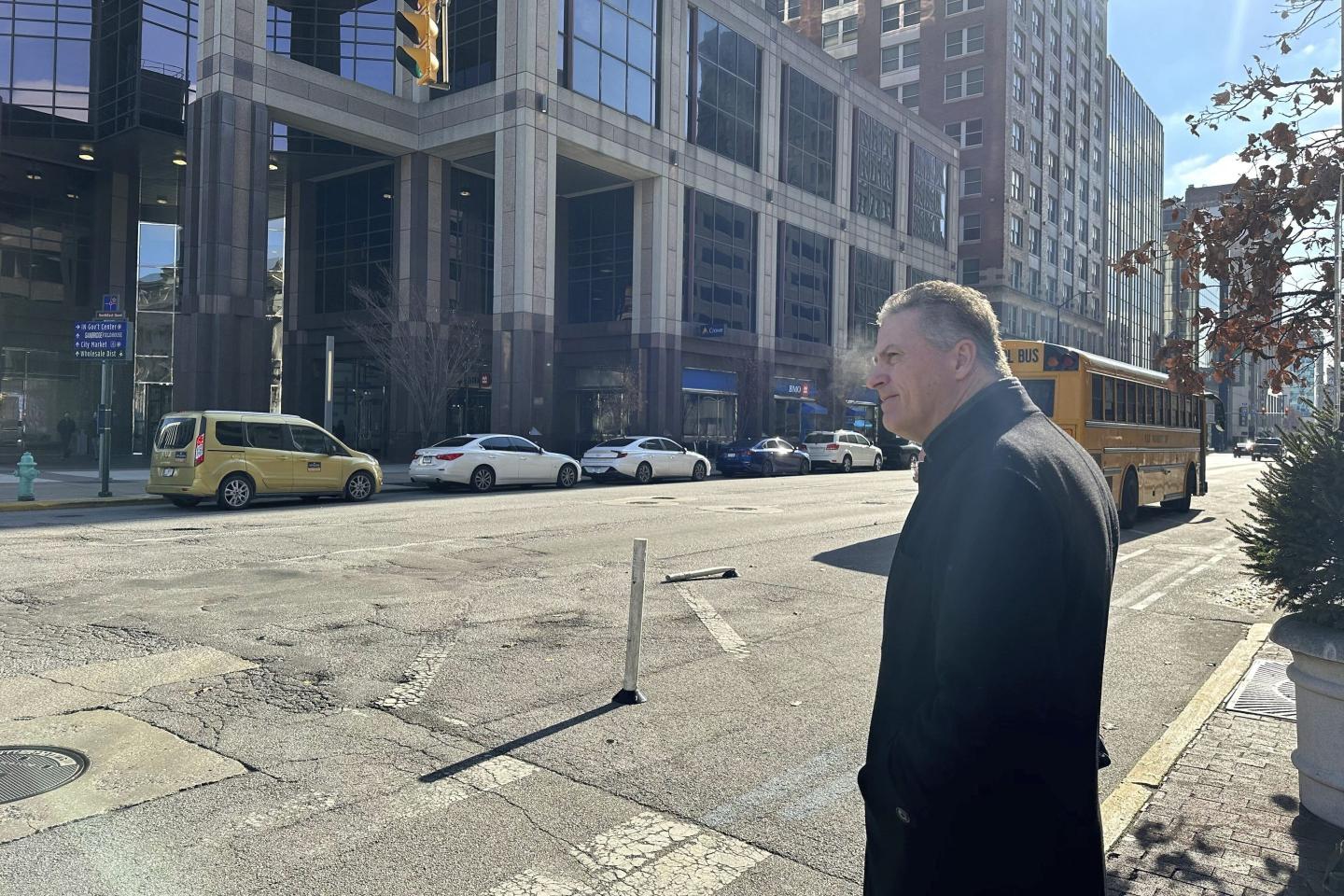 Former Indiana congressman Sean Eberhart stands at an intersection
