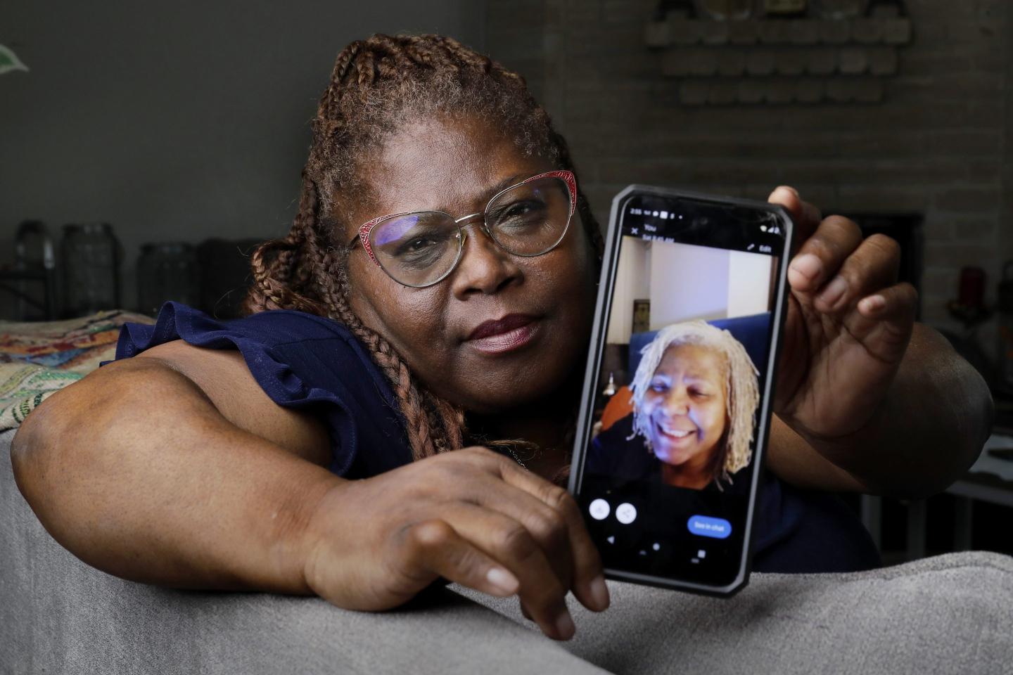 woman shows photo on her phone