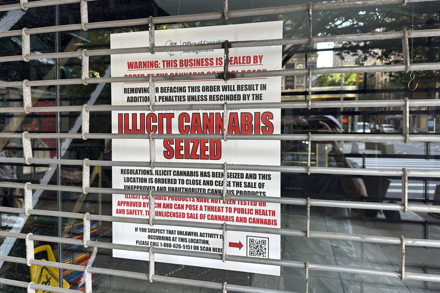 A notice from the Office of Cannabis Management is posted in the window of a closed shop, on New York's Upper West Side, June 21, 2024.