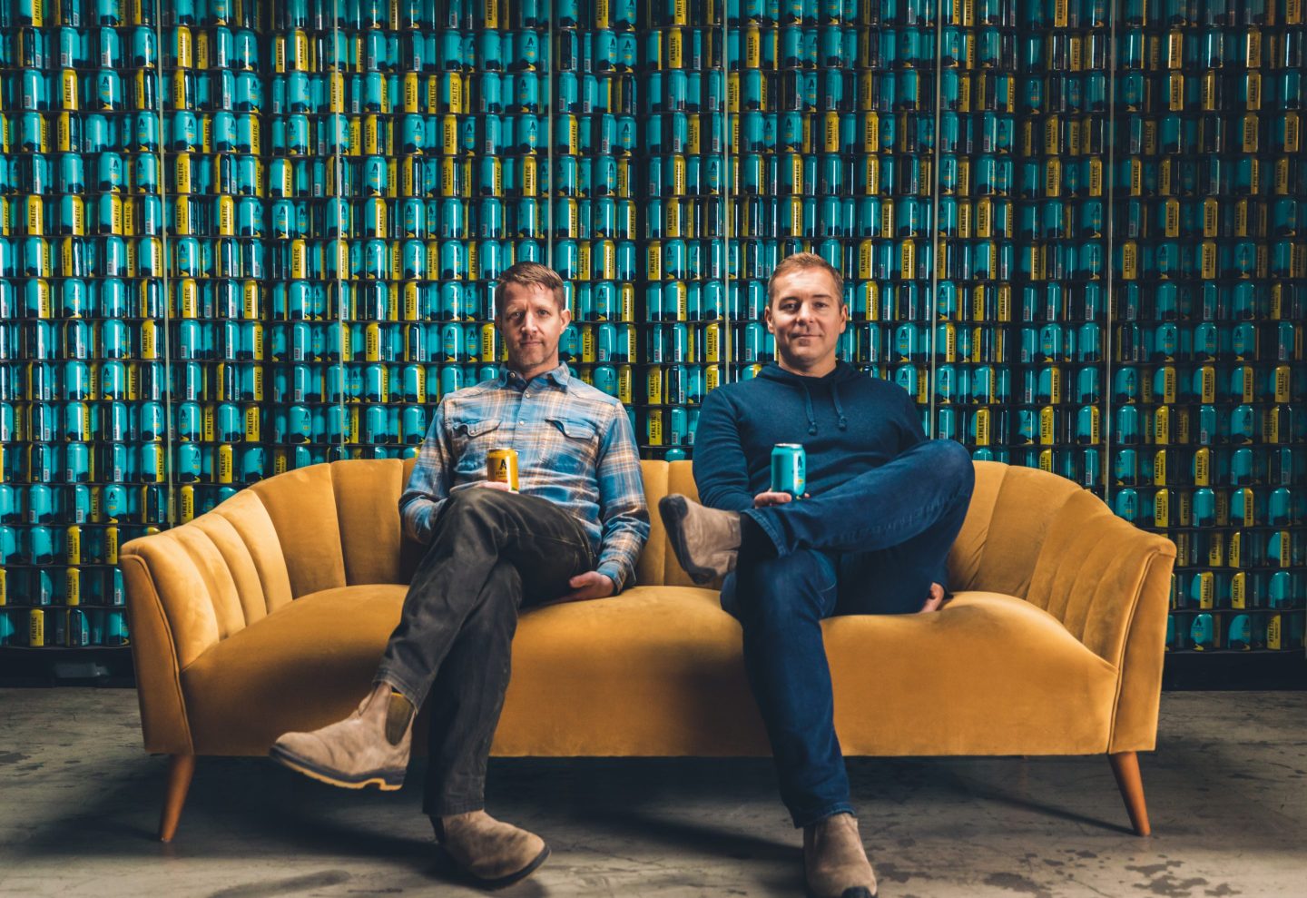 Athletic Brewing CEO Bill Shufelt (right) sits with cofounder John Walker.