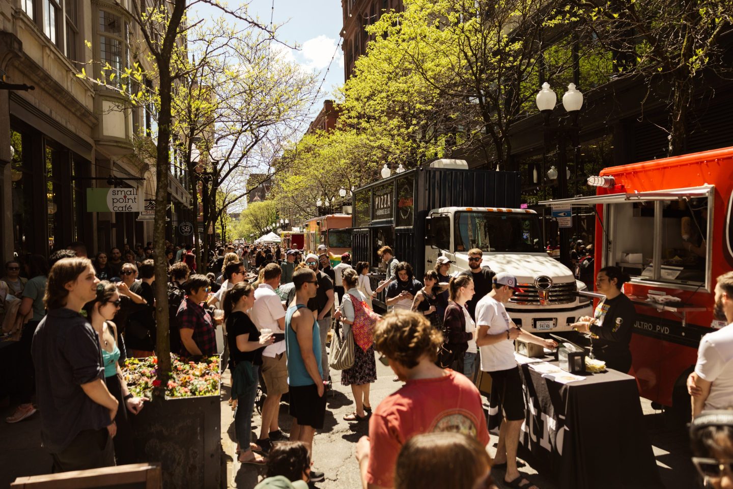 Family and friends attend the rock n' roll yard sale in the streets of Providence.