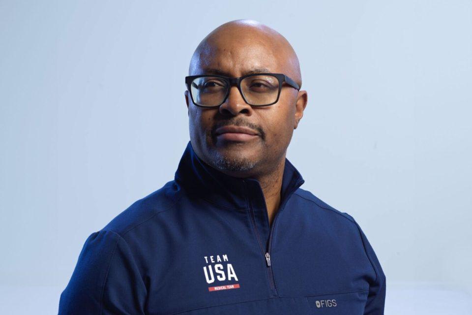 Kweku Smith, PhD, a psychological services provider for the U.S. Olympic and Paralympic Committee, models the Team USA medical team’s first official Olympics uniform, designed by Figs, ahead of the 2024 Summer Games in Paris.