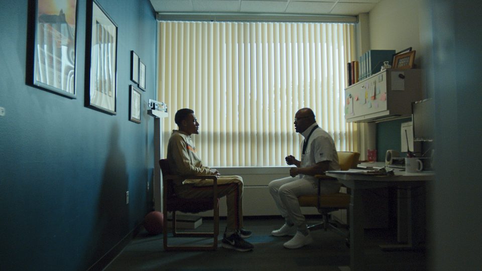 Kweku Smith, PhD (right), a psychological services provider for the U.S. Olympic and Paralympic Committee, speaks with a patient in a still from Figs’ “Anatomy of a Champion” ad. Figs, a medical apparel brand, designed the Team USA Medical Team’s first official Olympics uniform for the 2024 Summer Games in Paris.