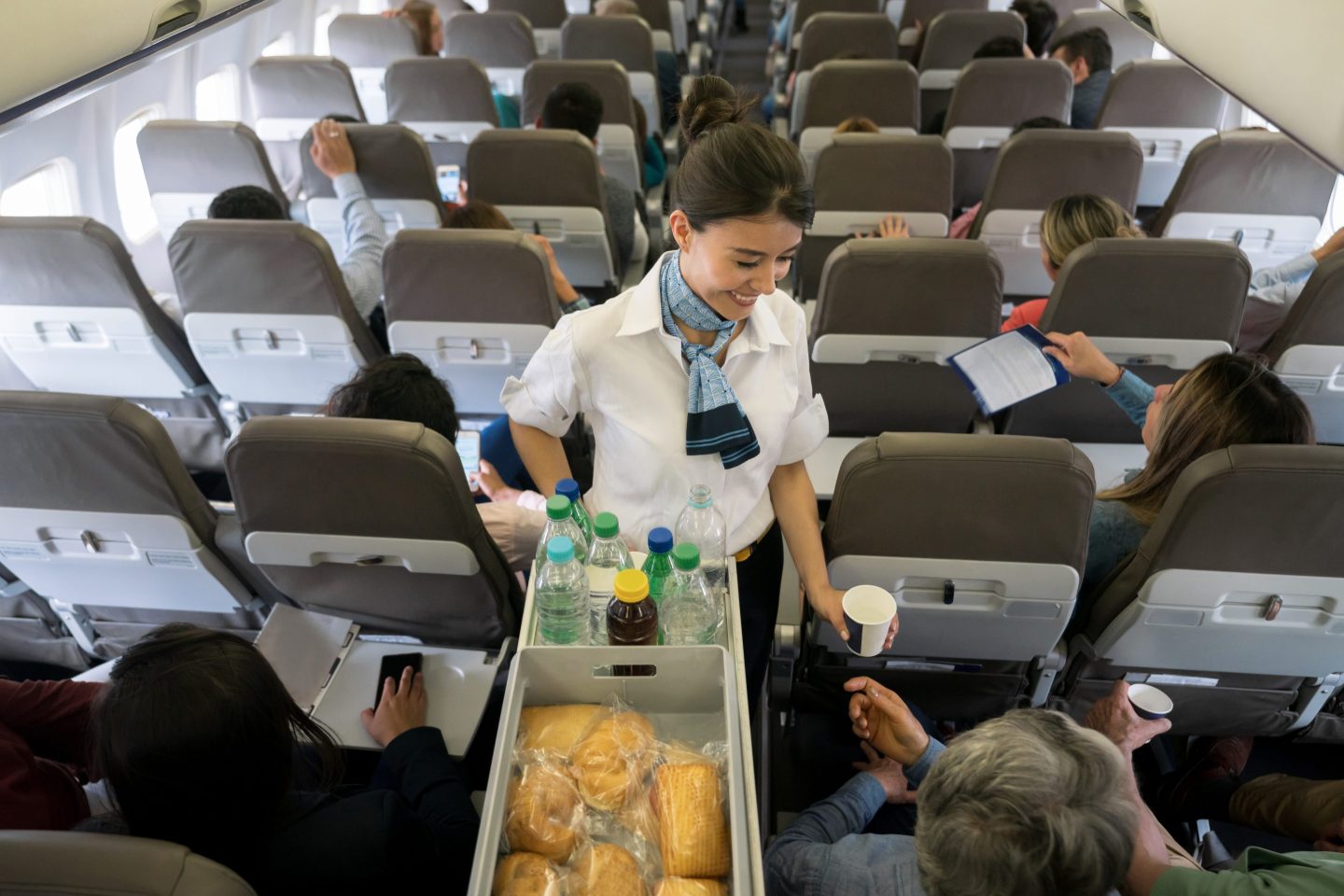 Flight attendant serving food