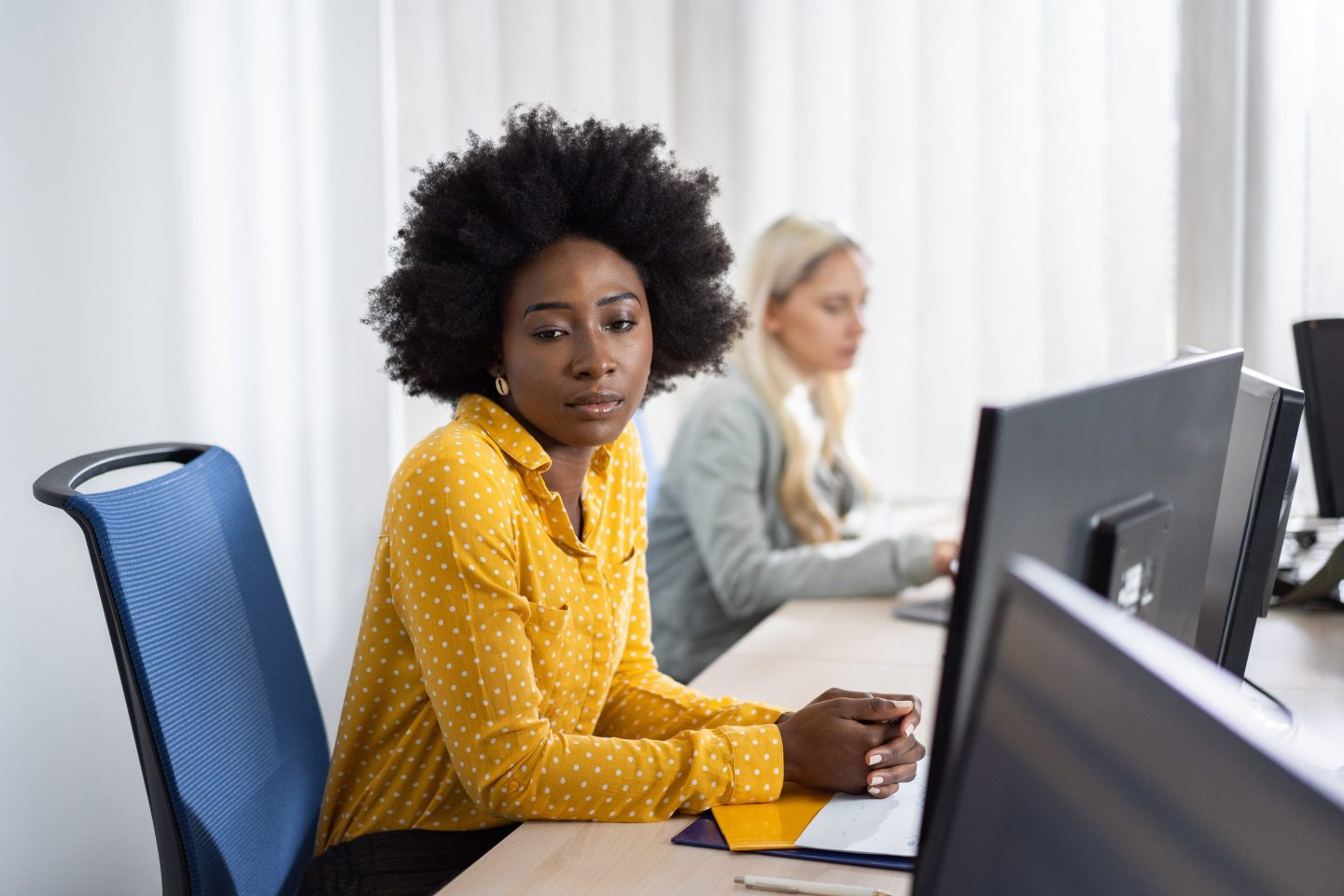 Businesswoman looks lonely while at work.