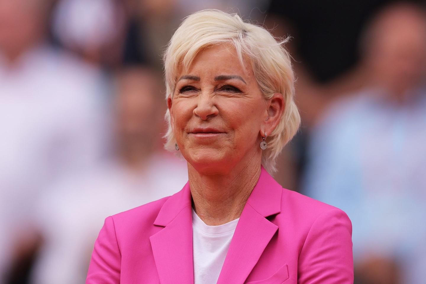 Close-up of Chris Evert wearing hot pink blazer over white T-shirt