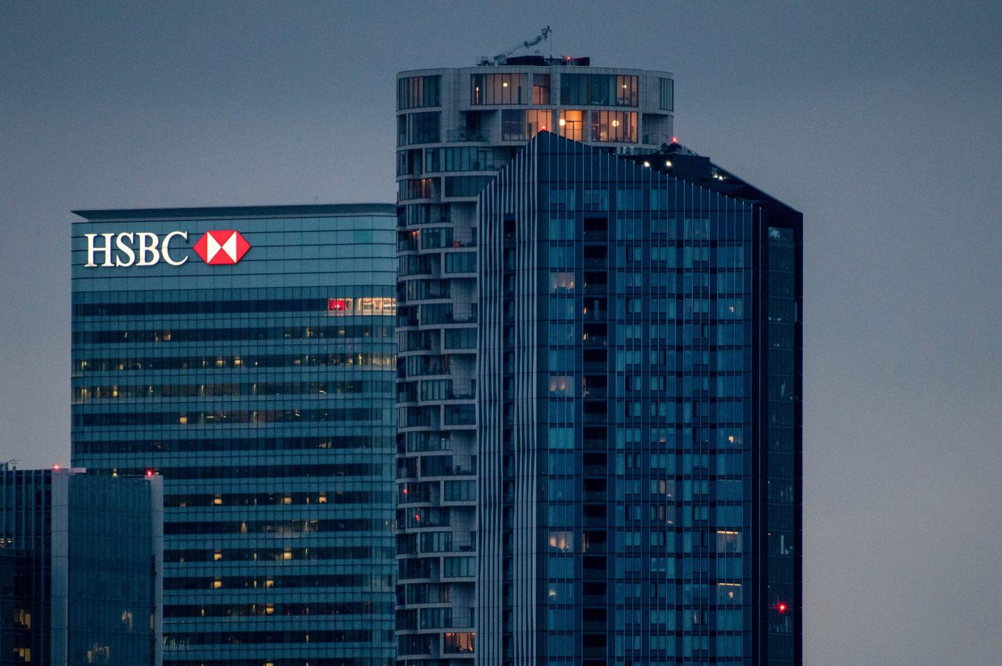 The HSBC Holdings Plc offices, left, in the Canary Wharf business, financial and shopping district in London, UK, on Tuesday, June 27, 2023. HSBC Holdings Plc has been looking for alternatives to its docklands skyscraper as it looks for a more flexible workspace and adapts to the post-Covid cityscape, and said its preferred option is BT Group Plc's former head office near St Paul's Cathedral. Photographer: Chris J. Ratcliffe/Bloomberg via Getty Images