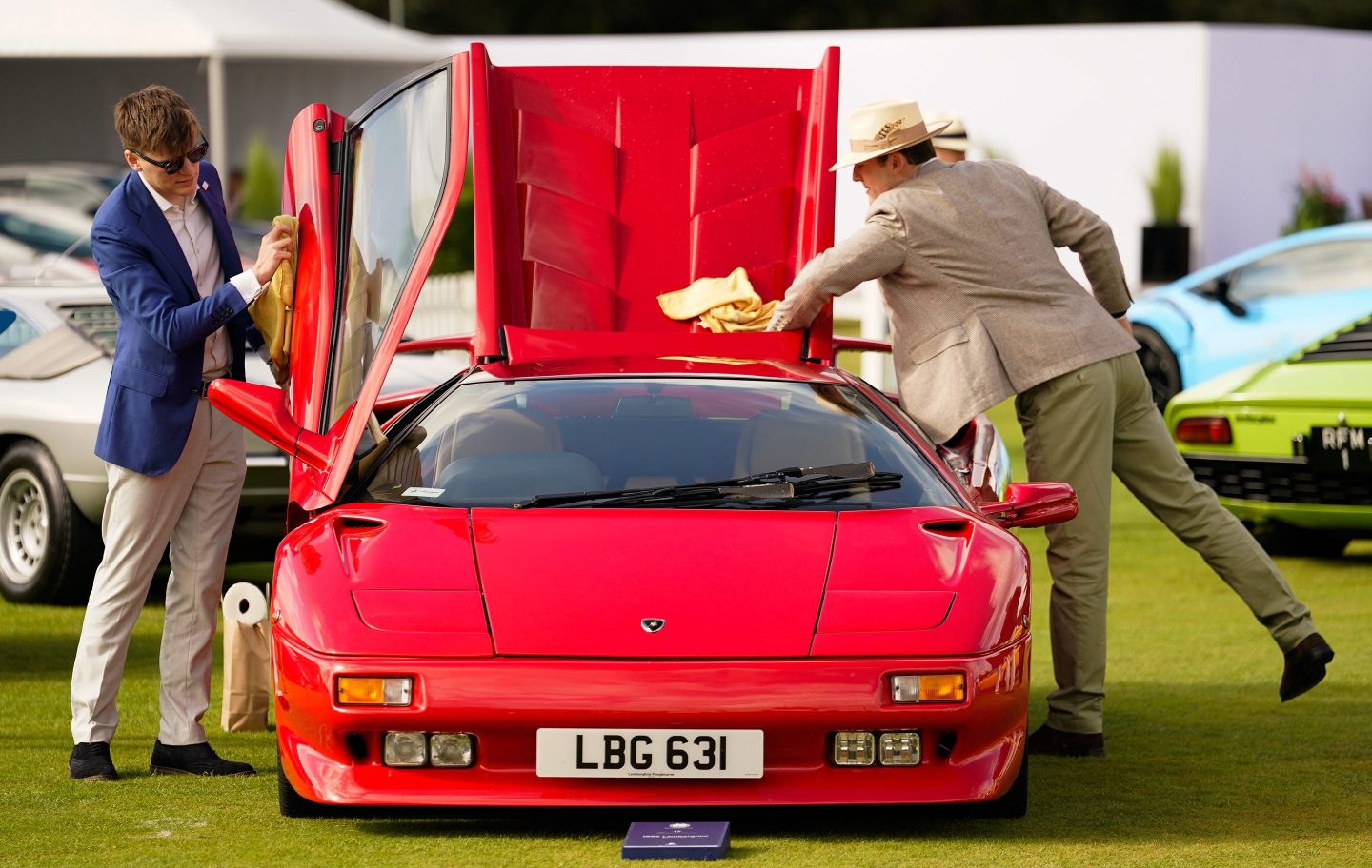 People clean a 1992 Lamborghini Diablo during the opening day of the Salon Prive Concours d'Elegance at Blenheim Palace in Oxfordshire. The event will see a host of luxury car manufacturers premiere their new models. Picture date: Wednesday August 30, 2023. (Photo by Andrew Matthews/PA Images via Getty Images)