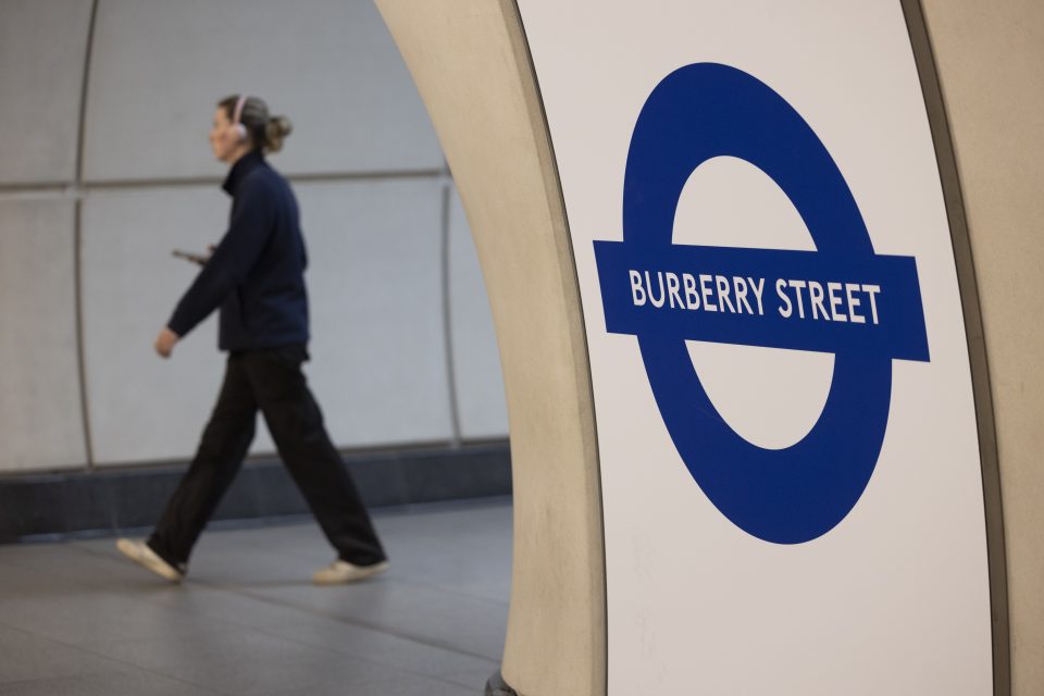 a woman walking in a tube station