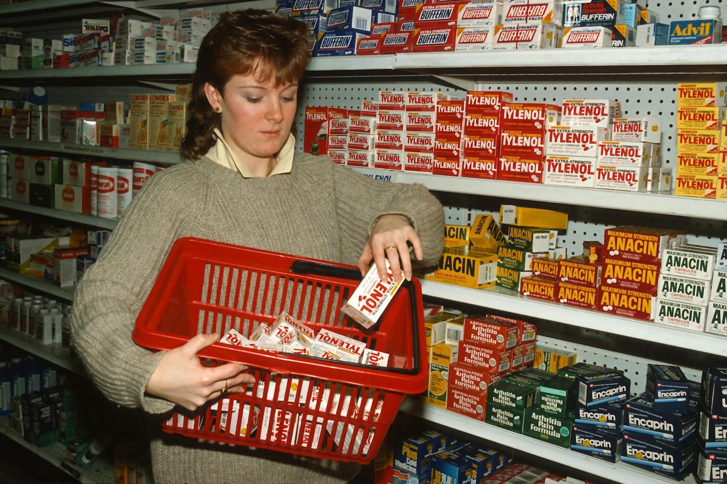 A drugstore clerk removes Tylenol bottles from the shelves of a pharmacy on September 30, 1982 in New York City after reports of tampering.