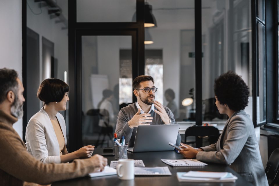 Group of people having a discussion in an office