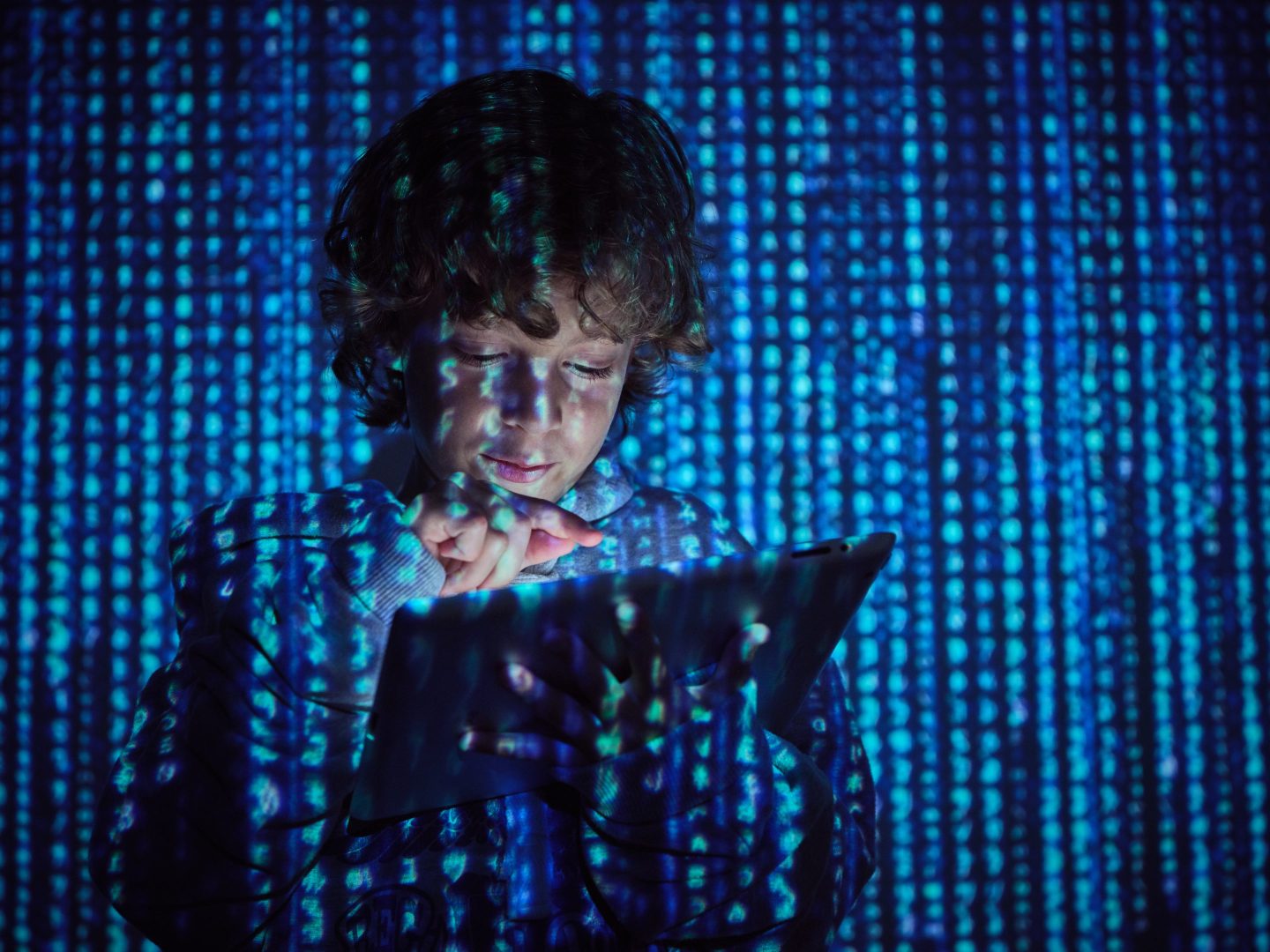 Programmer pressing button on tablet