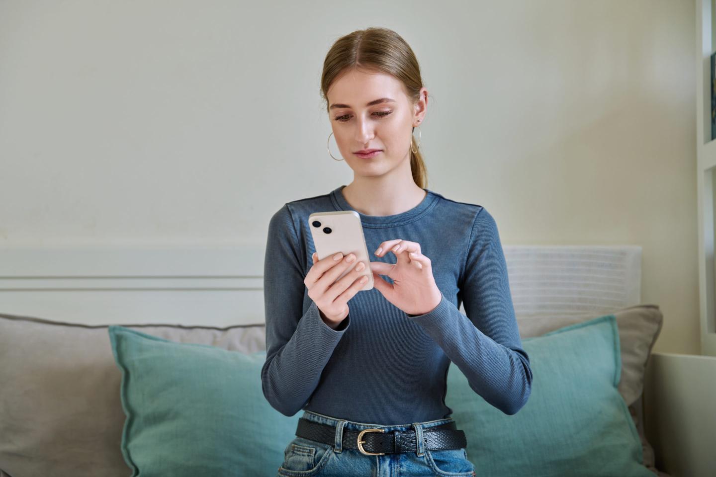Young woman using her smartphone