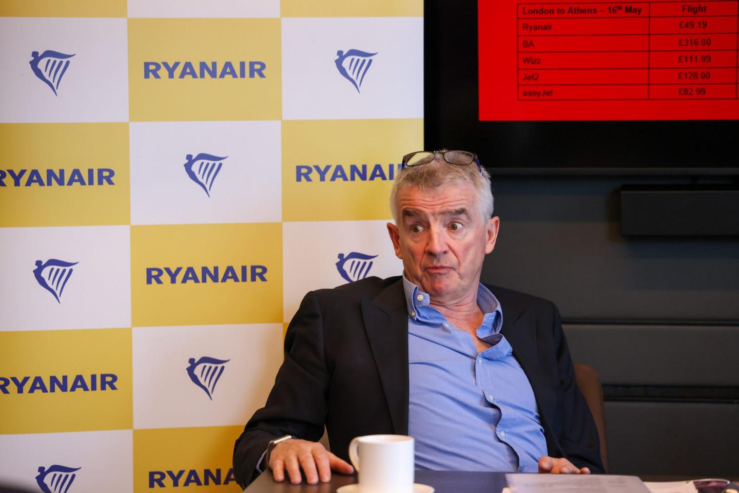 ryanair ceo Michael O'Leary sitting at a desk