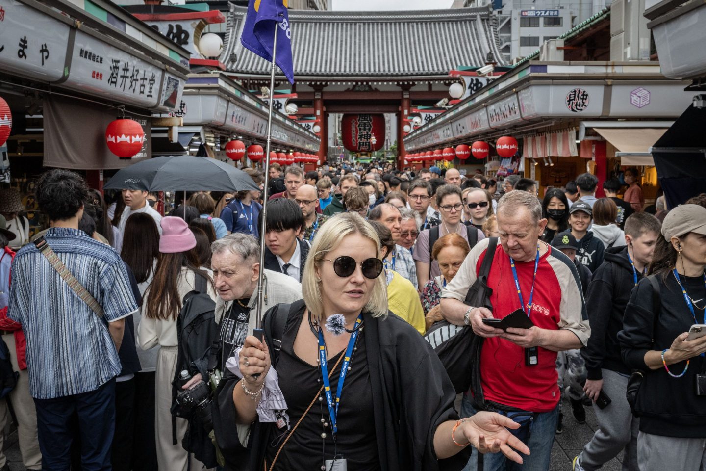 Tourists walk through Nakamise shopping street near Sensoji Temple in Tokyo on April 30, 2024.