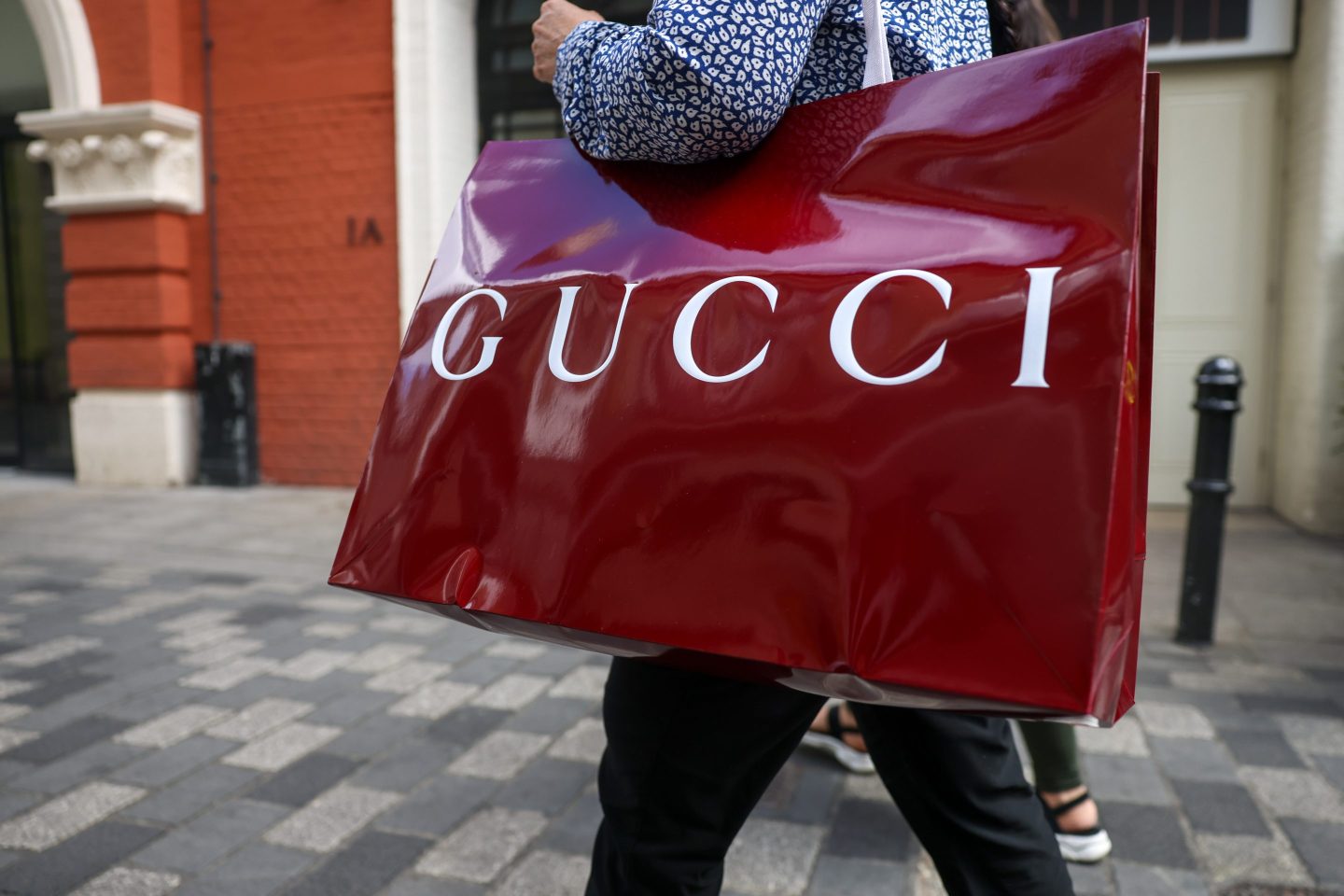 A shopper carrying a Gucci shopping bag in London, UK, on Friday, June 21, 2024. UK retail sales last month jumped at the strongest pace since January as consumers returned to shops to buy everything from clothes to furniture after a rainy April. Photographer: Hollie Adams/Bloomberg via Getty Images