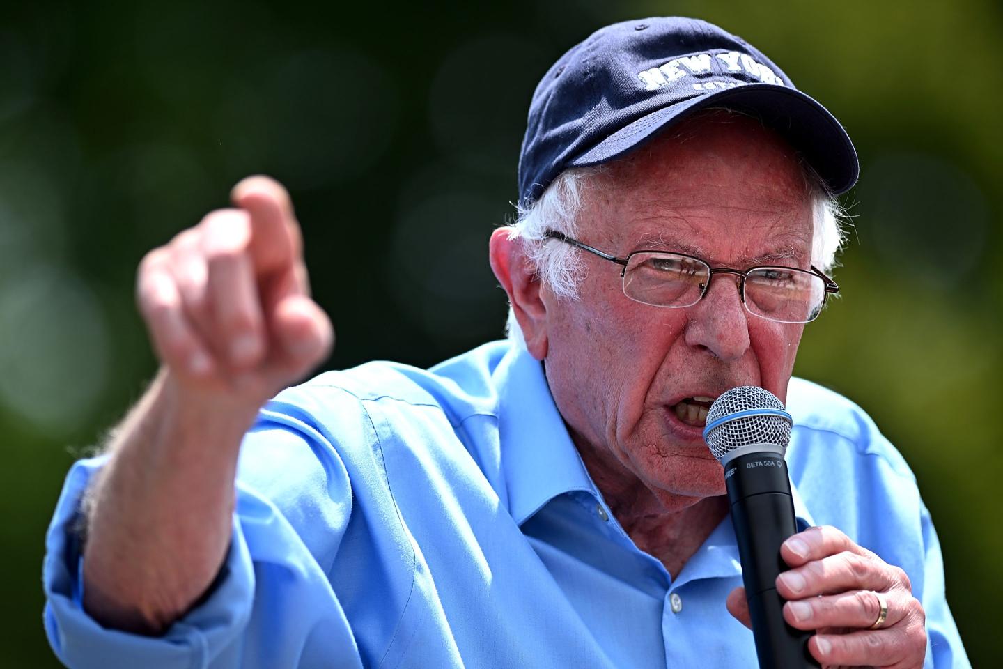 Bernie Sanders on the mic, looking angry