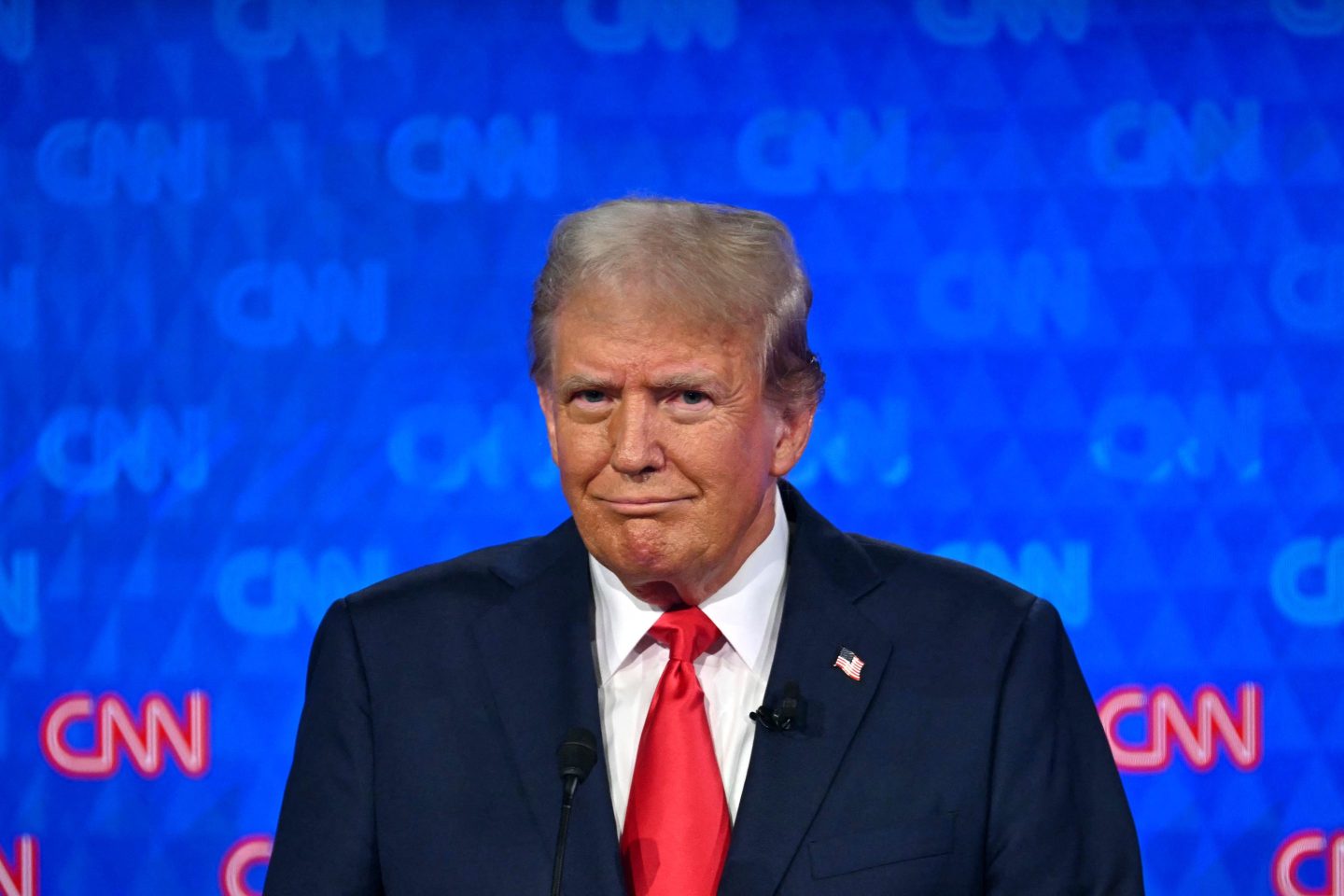 Donald Trump frowning on stage