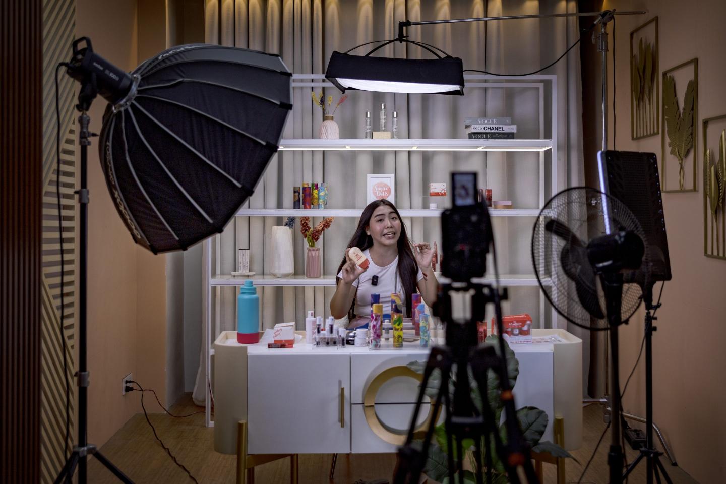 PULILAN, PHILIPPINES - JUNE 26: A live host promotes products for a skincare brand on a TikTok Shop livestream at one of the studios of Ownline Marketing on June 26, 2024 in Pulilan, Bulacan province, Philippines. Ownline Marketing, an agency that specializes in marketing brands on TikTok Shop and other e-commerce platforms, began only early this year with just one client but has quickly expanded to serving more than a dozen local and foreign brands, operating full production studios and delivering slick livestreams reminiscent of television home shopping channels. TikTok Shop, the e-commerce platform within the popular short video app, has spurred a booming live selling industry in the Philippines, where businesses are benefiting from TikTok's prized algorithm to sell more and faster, disrupting the market for other established e-commerce platforms in the region. However, a proposed bill in the Philippine Congress, House Bill 10489, introduced amid geopolitical tensions with China and following similar moves by other countries, aims to ban "foreign adversary-controlled" apps, likely targeting TikTok and could threaten the livelihoods of many Filipinos who have built their businesses on the platform​​​​. (Photo by Ezra Acayan/Getty Images)