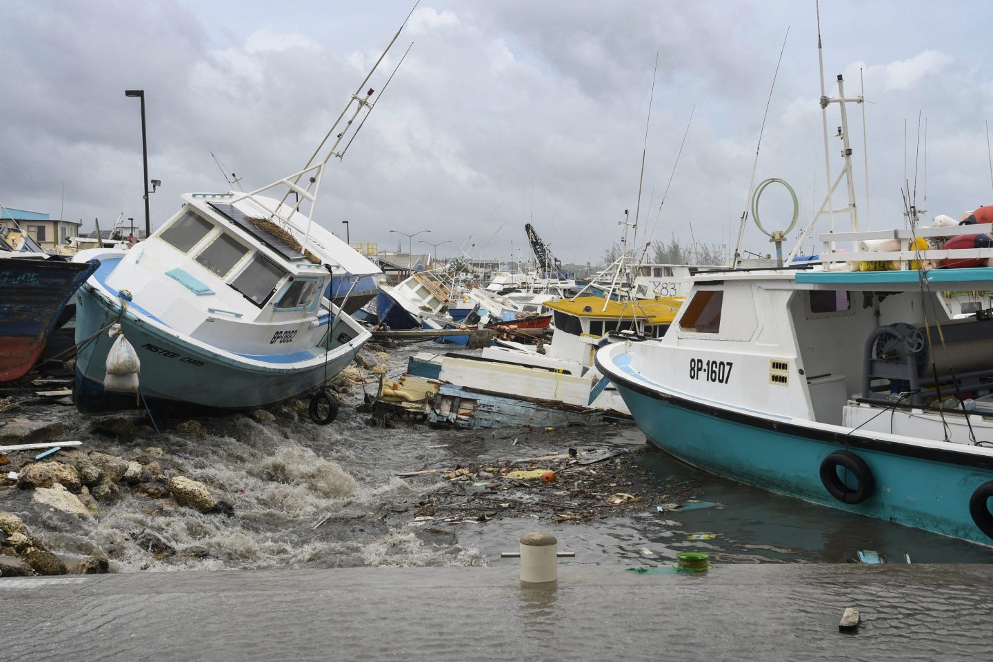 Damaged fishing boats rest on the shore after the passing of Hurricane Beryl at the Bridgetown Fish Market, Bridgetown, Barbados on July 1, 2024. The storm is now bearing down on Tulum, Mexico.