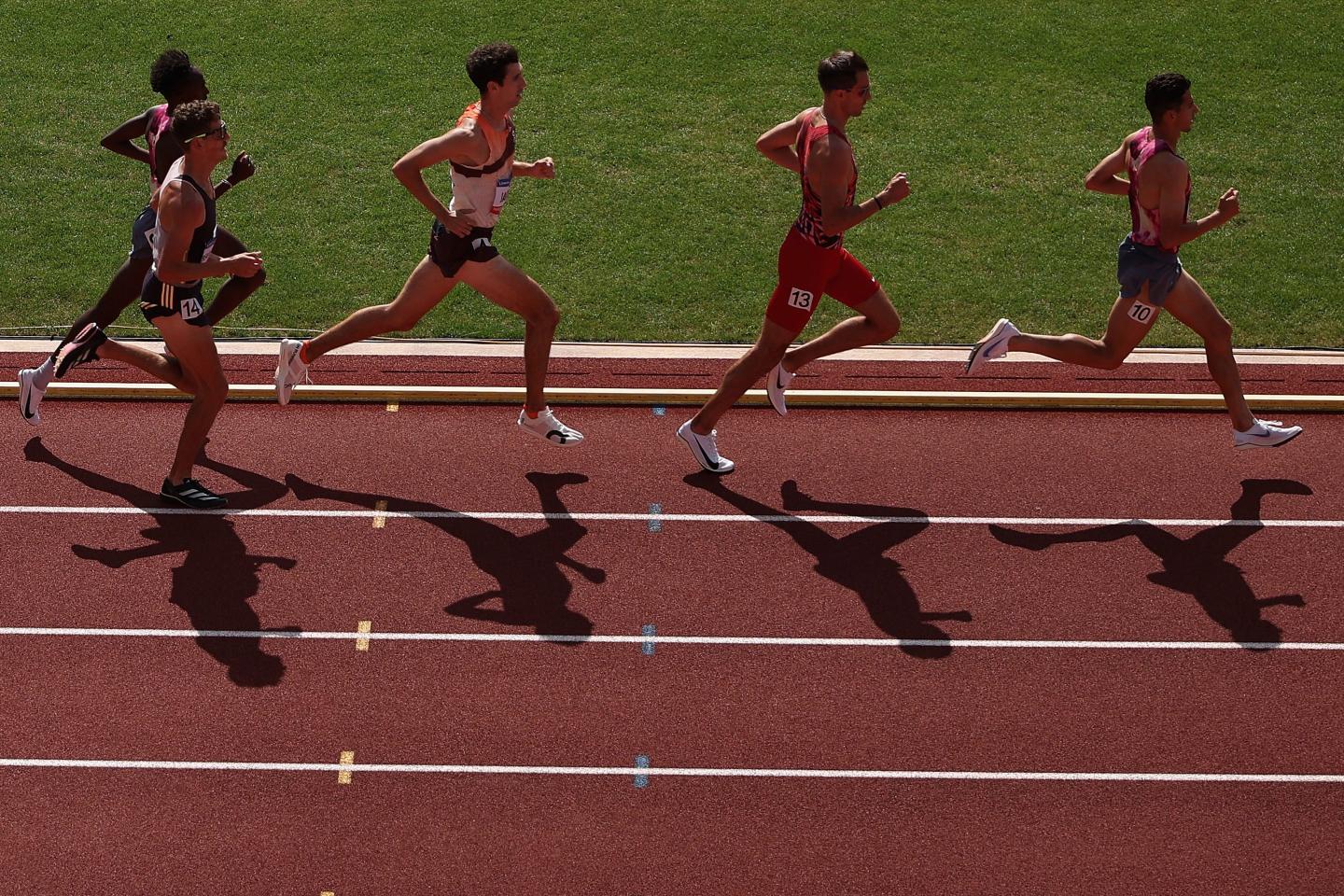four runners on a race track
