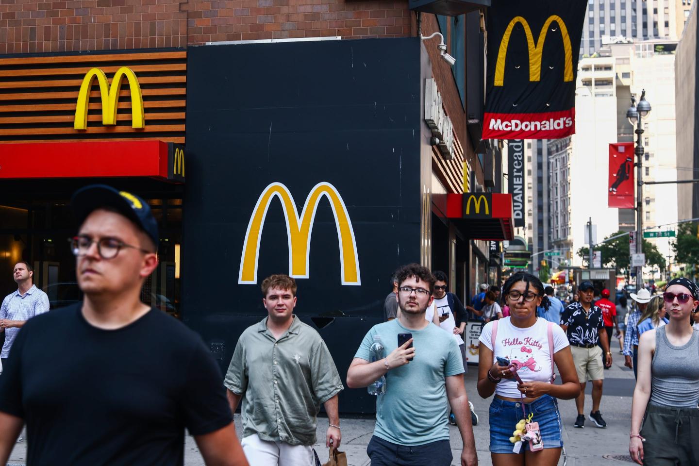 people walking by McDonald's