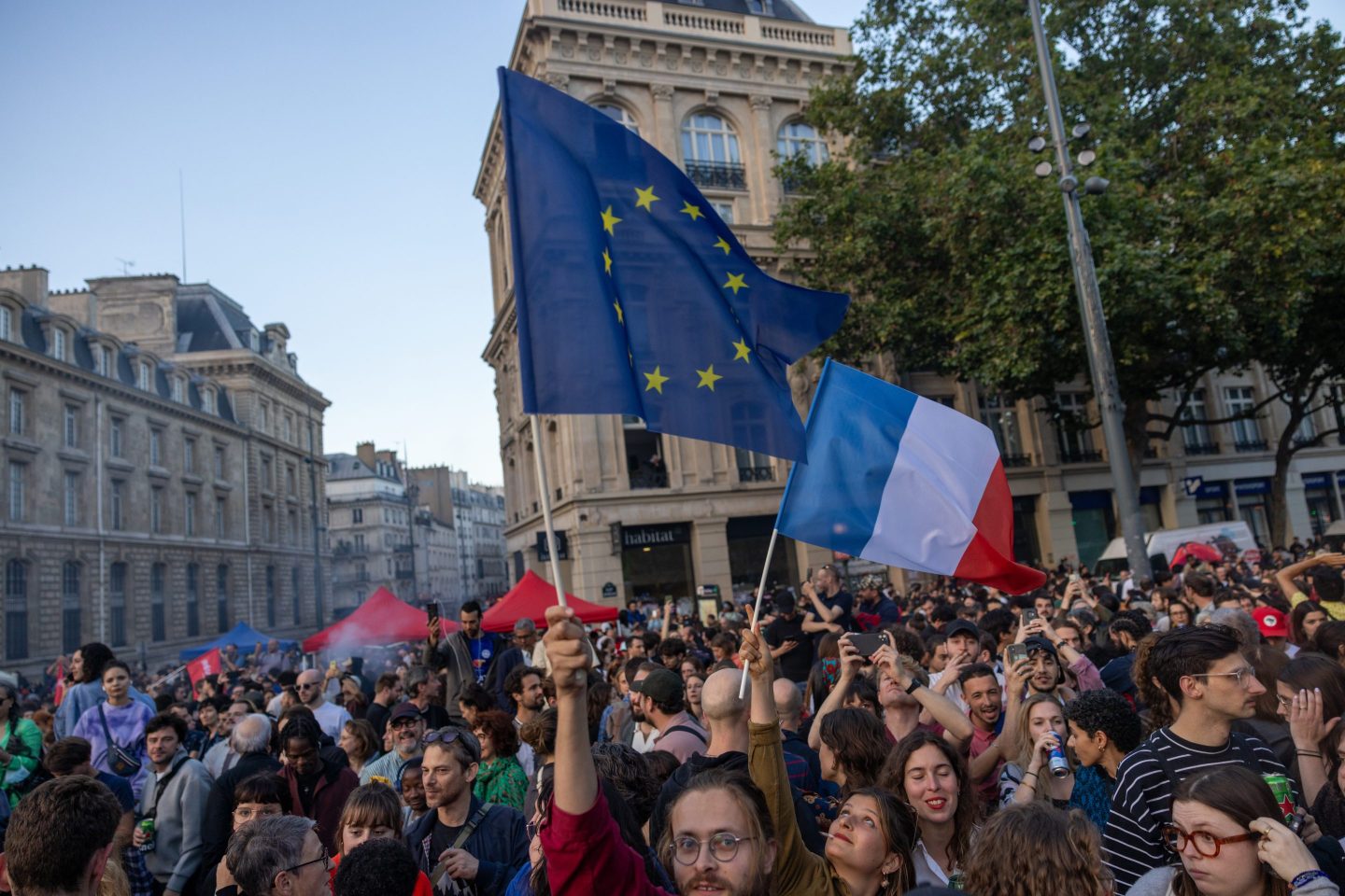 upporters of the left wing union, New Popular Front, gather at the Place de la Republique on July 7, 2024 in Paris, France following the defeat of the far-right in France's legislative elections.